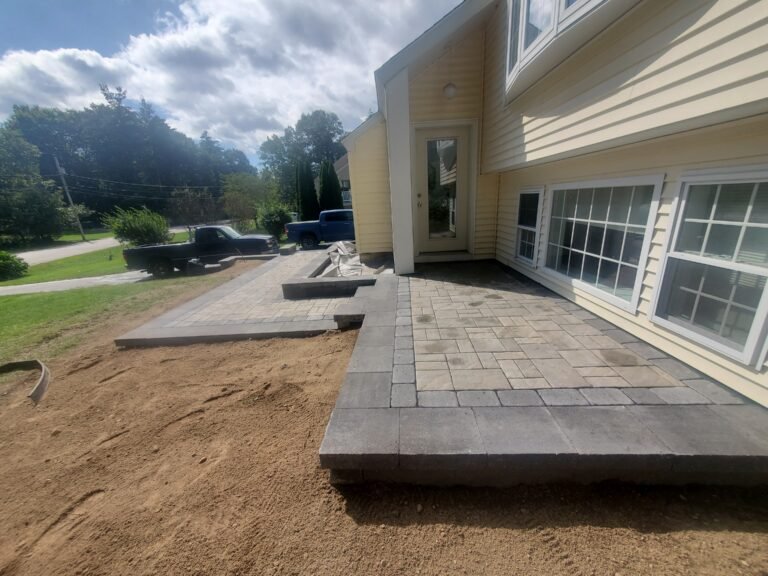 Masonry Paver walkway installation with clean, curved design