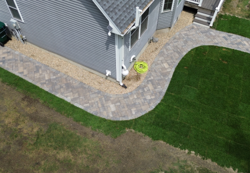 Stone retaining wall installation for landscape support and design