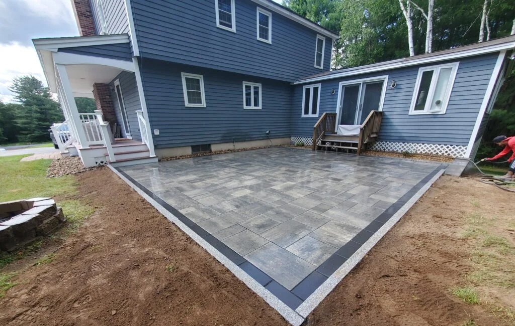 Outdoor patio with professionally installed granite edges for a refined finish