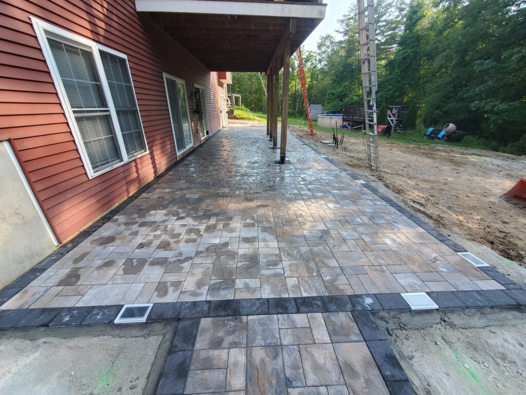 Masonry Hardscape design featuring a patio and decorative retaining wall